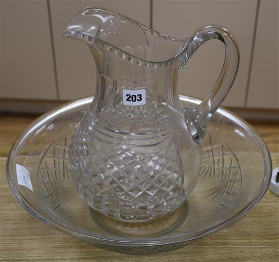 An Edwardian cut glass ewer and basin